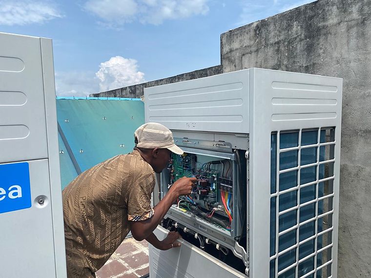 Engineer commissioning a VRF outdoor unit